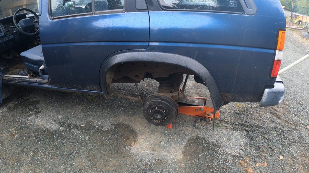 Removing the fender flares from a WD21 Nissan Pathfinder before fitting larger tires